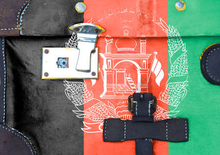 Afghanistan flag is on texture. Template. Coronavirus pandemic. Countries may be closed. Locks.の写真素材