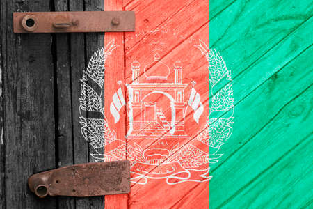 Afghanistan flag is on texture. Template. Coronavirus pandemic. Countries may be closed. Locks.の写真素材