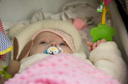 Close up baby girls. The child enjoys life. Early childhood.