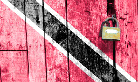 Trinidad and Tobago flag is on texture. Template. Coronavirus pandemic. Countries may be closed. Locks.の写真素材