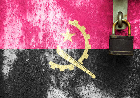 Angola flag is on texture. Template. Coronavirus pandemic. Countries may be closed. Locks.の写真素材