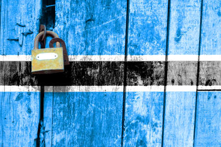 Botswana flag is on texture. Template. Coronavirus pandemic. Countries may be closed. Locks.の写真素材
