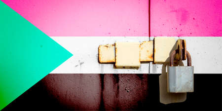 Sudan flag is on texture. Template. Coronavirus pandemic. Countries may be closed. Locks.の写真素材