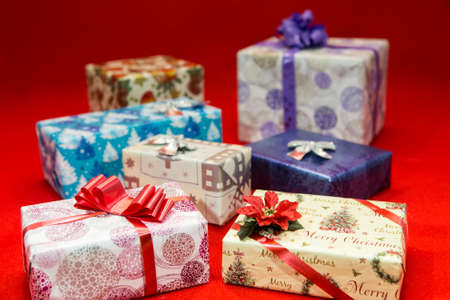 Christmas gift boxes on a red background. Blank for the designer.