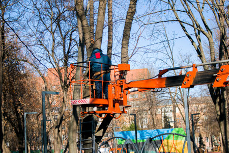 Municipal service decorate street lamp for celebration of Christmas and New Year. Installation and...