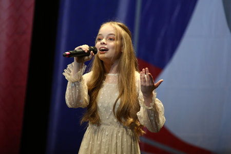 Concert Hall "Cosmos", Moscow, Russia - 11.17.2018: International competition-festival of creative teams "Energy of Creativity" and "Steps of Mastery". Beautiful girl sings on stage.のeditorial素材