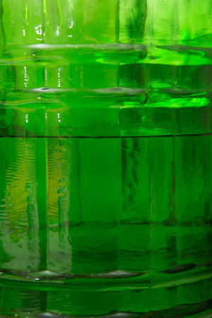 Green background. Clos-up green container for food liquids.の写真素材