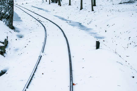 Winter railway road with white snow. Rails in the snow.の写真素材