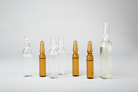 Medical ampoules for injection isolated on white background. Medicines and disease treatment, pharmacology and science conceptsの写真素材