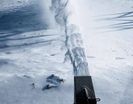 Tracked snow blower at work. After heavy snowfalls, snow is removed everywhere.の写真素材