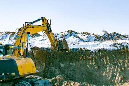 Crawler excavator. Earth-moving machine at a construction site. The excavator in the process of work...