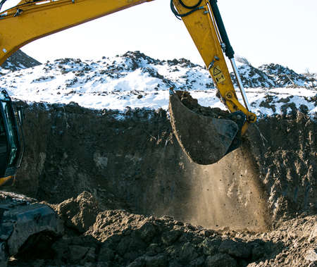 Crawler excavator. Earth-moving machine at a construction site. The excavator in the process of work...