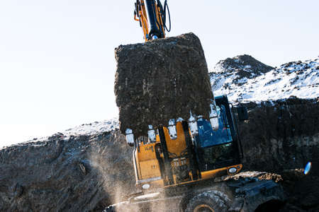 Crawler excavator. Earth-moving machine at a construction site. The excavator in the process of work...