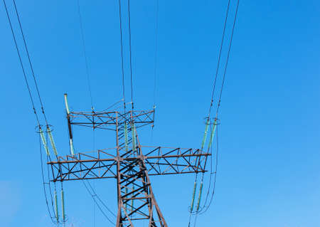 Power lines. High voltage power line against the blue sky.