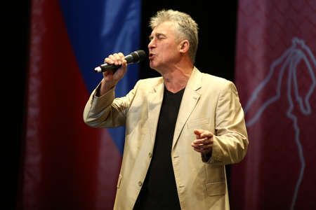 Concert Hall "Cosmos", Moscow, Russia - 11.17.2018: International competition-festival of creative teams "Energy of Creativity" and "Steps of Mastery" .A man sings on stage.のeditorial素材