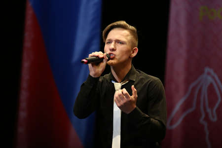 Concert Hall "Cosmos", Moscow, Russia - 11.17.2018: International competition-festival of creative teams "Energy of Creativity" and "Steps of Mastery". The guy is a teenager singing on stage.のeditorial素材