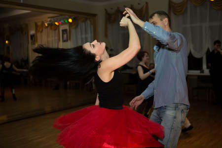 Dnepropetrovsk, Ukraine - 02.26.2017: Dance evening in a city cafe. A man and a woman are dancing salsa.のeditorial素材