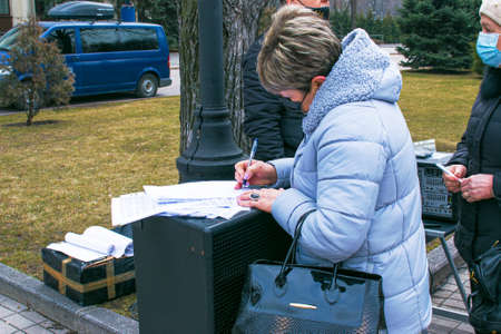 Dnepropetrovsk, Ukraine - 03.19.2021: Businessmen gathered to protest against the introduction of the lockdown and sign a petition to the authorities.のeditorial素材