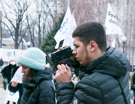 Dnepropetrovsk, Ukraine - 03.19.2021: Journalists work at a rally of entrepreneurs to protest the imposition of quarantine.のeditorial素材