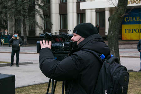 Dnepropetrovsk, Ukraine - 03.19.2021: Journalists work at a rally of entrepreneurs to protest the imposition of quarantine.のeditorial素材