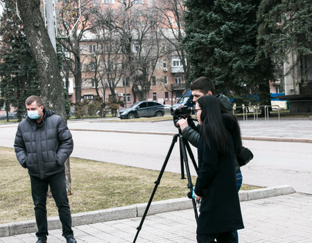 Dnepropetrovsk, Ukraine - 03.19.2021: Journalists work at a rally of entrepreneurs to protest the imposition of quarantine.のeditorial素材