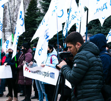 Dnepropetrovsk, Ukraine - 03.19.2021: Journalists work at a rally of entrepreneurs to protest the imposition of quarantine.のeditorial素材