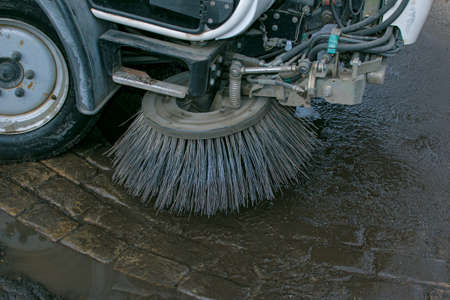 Close-up sweeper machine cleaning. Concept clean streets from debris. Selective focus.の写真素材