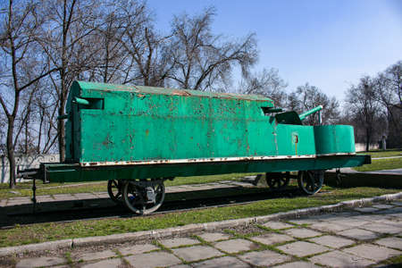 Dnepropetrovsk, Ukraine - 04.01.2021: armored train in the open-air museum. An armored train from the First World War, Maxim machine gun, old artillery piece, wheels from the early twentieth century.のeditorial素材