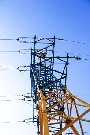Power lines. High voltage power line against the blue sky.