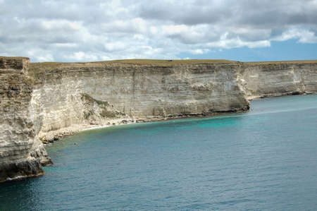 Coast of the Black Sea in Crimea. A rocky coast and solitary rocks in the sea are typical for...