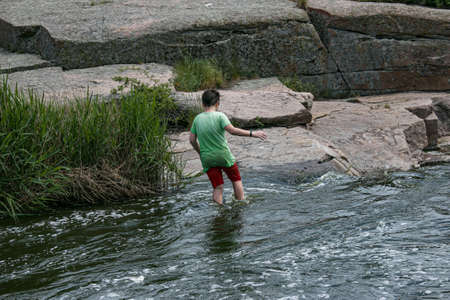 Active recreation concept. A group of young people is rafting down the river.の写真素材