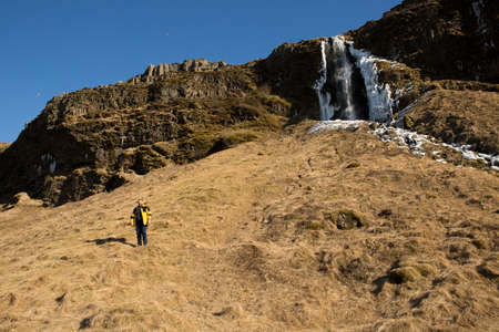 Iceland - 11/03/2018: A small man against the backdrop of a manless nature.のeditorial素材