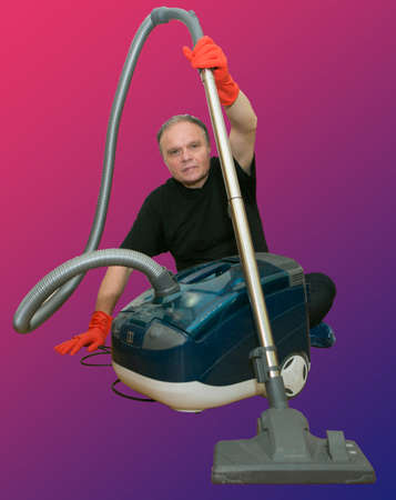 Emotions of a middle-aged man before cleaning the apartment. Daily cleaning of the premises. Humor. A man holds a vacuum cleaner in his hands. Isolate. Collage.の写真素材