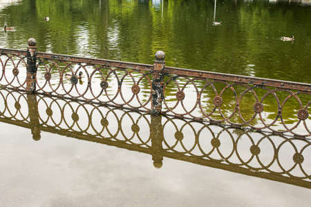 Public park drenched in rain. Water logged park.Wet benches. Park filled with water after rain.Empty...