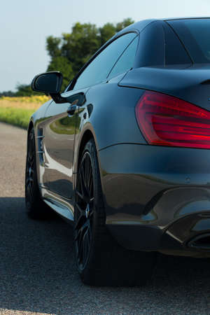 Dnepropetrovsk, Ukraine - 08.24. 2021: Photos of the Mercedes Benz SL550 convertible on the road.