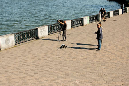 Dnepropetrovsk, Ukraine - 09.17.2021: Local TV reporters using drone filming on an environmental disaster.のeditorial素材