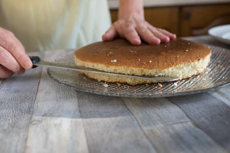 Step-by-step process of making a sour cream chocolate cake. Forming the cake. The chocolate cake is...