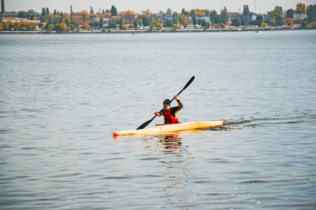 Dnepropetrovsk, Ukraine - 10.16.2021: Young people train in the practice of canoeing on the Dnieper River. Sport. Healthy lifestyle concept.のeditorial素材