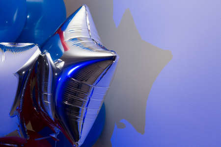 Blue, silver and red balloons. Decorations for the holiday. Blank for a greeting card.の写真素材