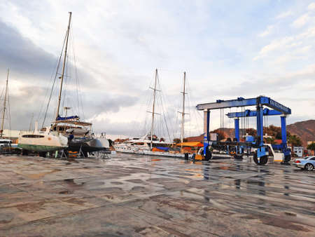 Bodrum, Turkey - 10.12.2021: Modern sailing yacht at the shipyard. Sport yacht docked in dry dock on...