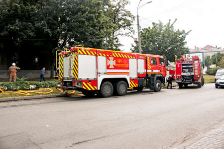 Dnepropetrovsk, Ukraine -09.20.2021: A fire truck on the roadway arrived at the scene of the fire.