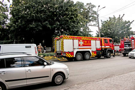 Dnepropetrovsk, Ukraine -09.20.2021: A fire truck on the roadway arrived at the scene of the fire.