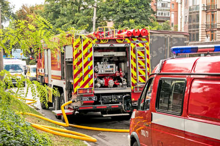 Dnepropetrovsk, Ukraine -09.20.2021: A fire truck on the roadway arrived at the scene of the fire.