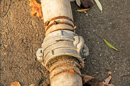 Connection of pipes for pumping water from the pond using a coupling and a wire. Over time, the wire rusts and the pipes leak.の写真素材