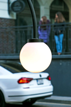 Background image of an outdoor lamp, focus on a classic light bulb with wiring. Copy space.の写真素材