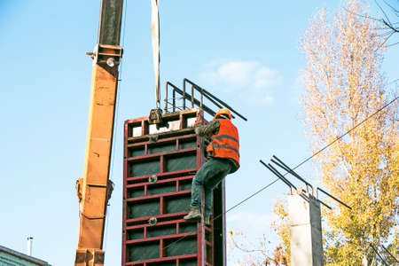 Preparation and assembly of formwork for reinforced concrete columns during the construction of a...