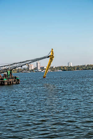 Dredger on the river. Cleaning the bottom of the river. conservation river flow. Nature, river, sky,...