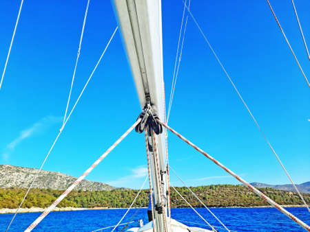 View from the bow of a sailing yacht sailing under the wind.