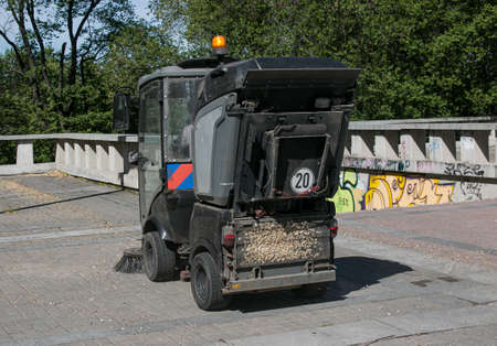 Close-up sweeper machine cleaning. Concept clean streets from debris. selective focus.