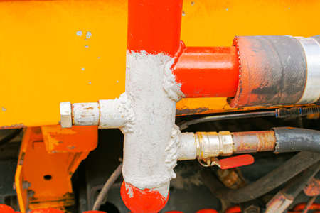The mechanical assembly of a lawn watering machine. Equipment repair concept.